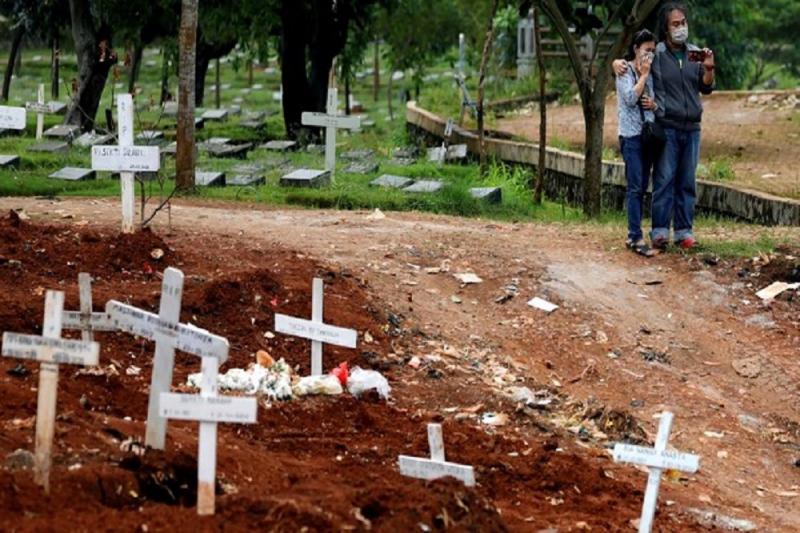 Ilustrasi TPU Serengseng Sawah, Jakarta Selatan dijadikan TPU khusus untuk pasien Covid-19 (REUTERS/Willy Kurniawan)